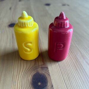 Mustard and ketchup salt and pepper shakers.